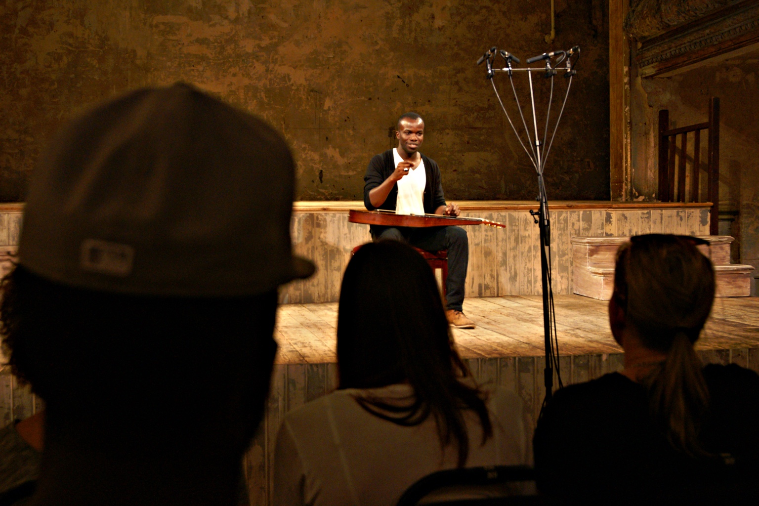 TJ on stage seen between audience members