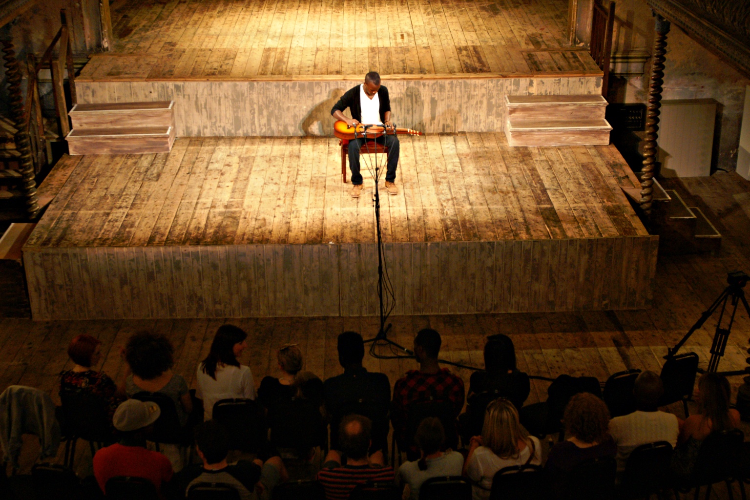 TJ performing at Wilton’s with the audience in the foreground